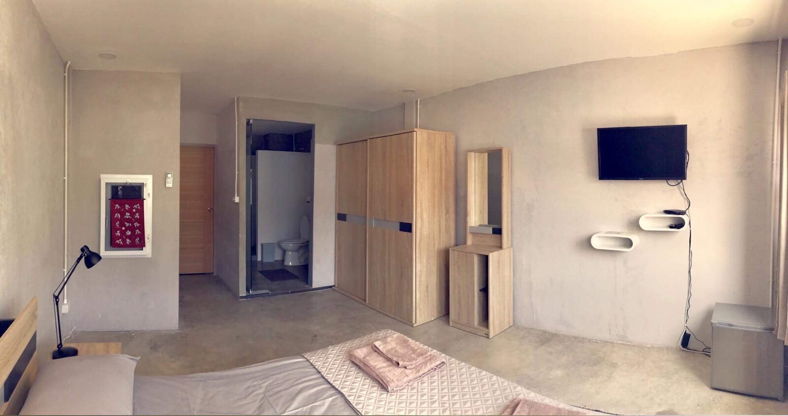 Apartment in Club bedroom with wardrobe, desk, and bathroom