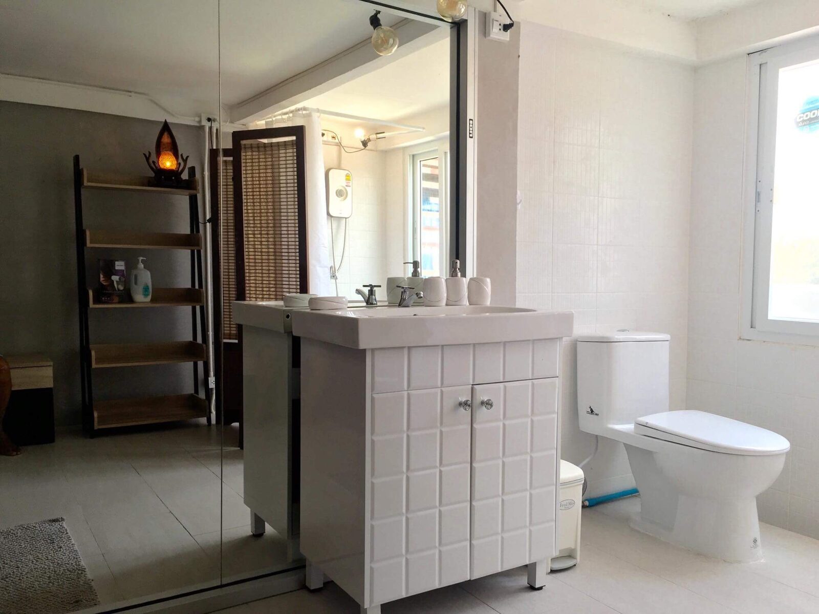 Rooftop Apartment bathroom with a tiled vanity and toilet