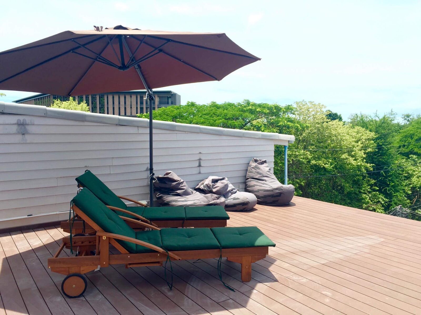 Rooftop deck with sun loungers and bean bags