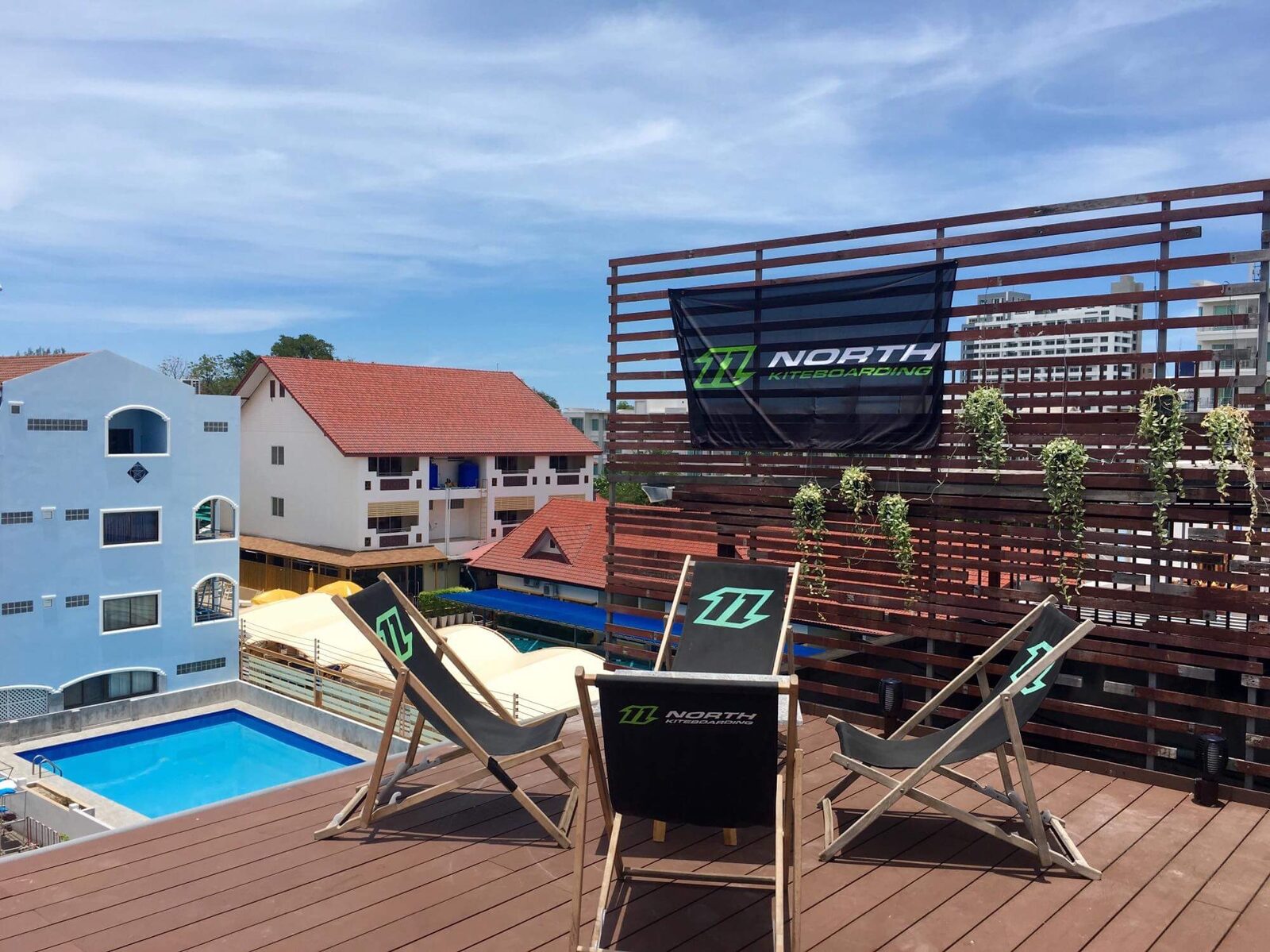 Rooftop deck chairs beside the pool